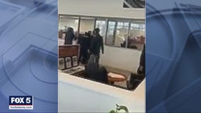 Employees subdue armed man firing shots inside car dealership