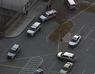Crime scene tape surrounds the parking lot of Perimeter Center West in Dunwoody on Dec. 8, 2022.
