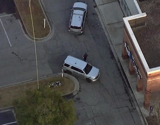 Crime scene tape surrounds the parking lot of Perimeter Center West in Dunwoody on Dec. 8, 2022.
