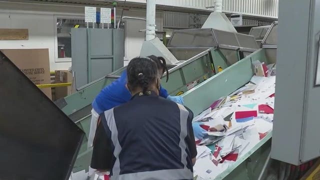 Postal employees work overtime to help deliver Christmas on time