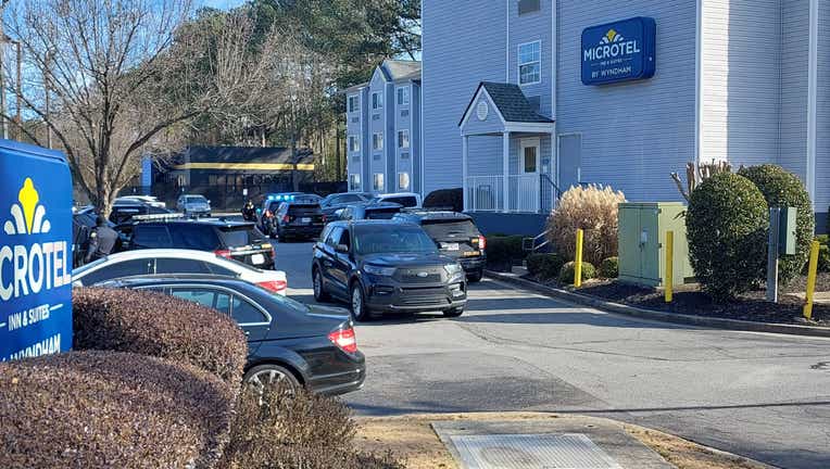 Police investigate a shooting at Microtel in Brookhaven.