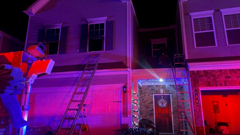 Firefighters respond to a blaze at a townhome in Paulding County on Dec. 18, 2022.