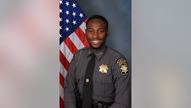 The Fulton County Sheriff's Office said Deputy James Thomas was found fatally shot in his car in northwest Atlanta. 