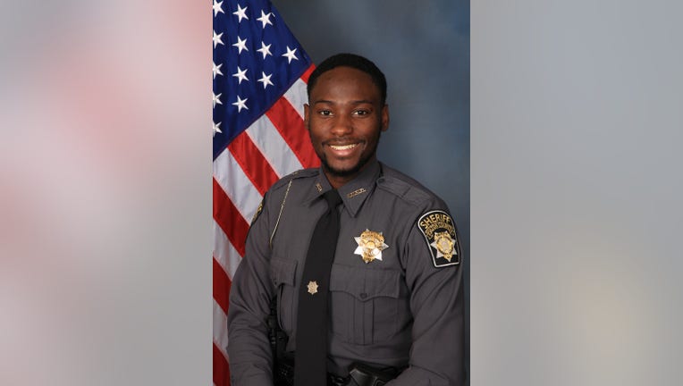 The Fulton County Sheriff's Office said Deputy James Thomas was found fatally shot in his car in northwest Atlanta.
