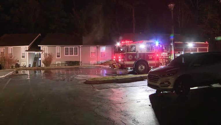 Firefighters investigate a blaze on Dec. 2 at the Rockledge apartments on Powers Ferry Road.