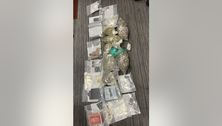 A drug raid leads to police confiscating handguns, 47 grams of cocaine, 92 grams of mushrooms, 301 grams of promethazine, and nearly seven pounds of marijuana. 