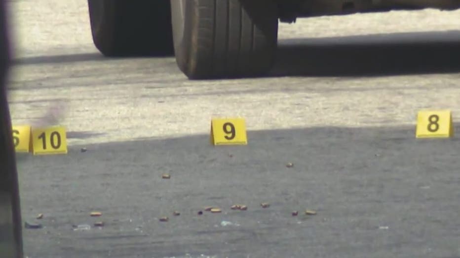 Dozens of markers litter a southwest Atlanta roadway after a shootout on Dec. 30, 2022.