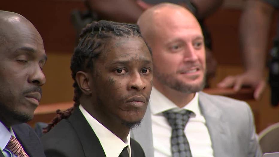 Rapper Young Thug sits in a Fulton County courtroom during a motions hearing on Dec. 15, 2022.