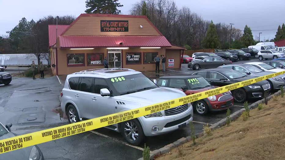 Gwinnett County police investigate the death of a woman at a car dealership near the corner of Centerville Highway and Annistown Road on Dec. 9, 2022.