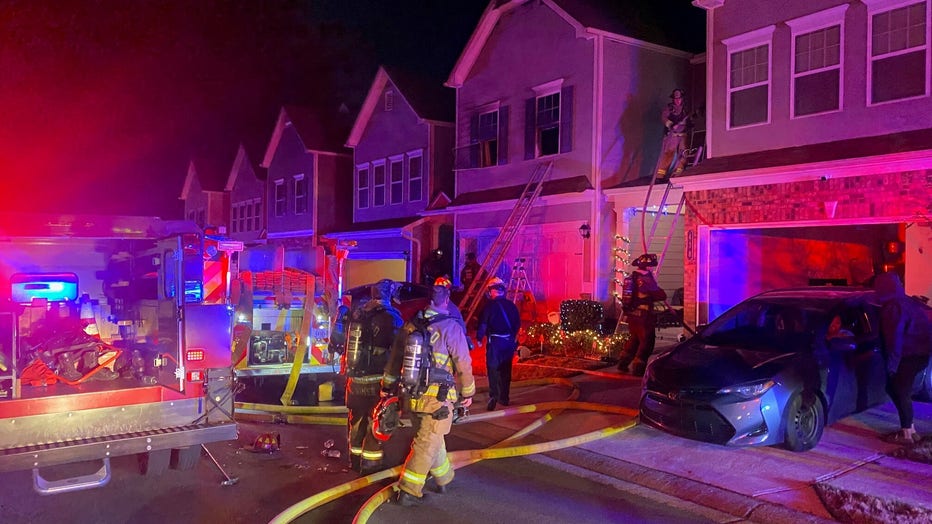 Firefighters respond to a blaze at a townhome in Paulding County on Dec. 18, 2022.