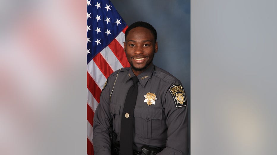 The Fulton County Sheriff's Office said Deputy James Thomas was found fatally shot in his car in northwest Atlanta.