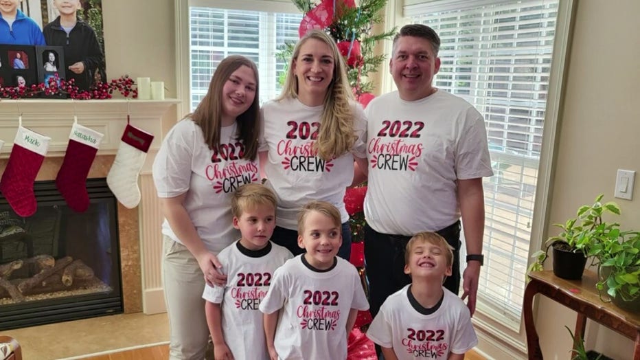 Natasha Zelinska with her teacher Bethany Lambert and her husband, and their 5-year-old triplets, Whit, Tate and Mack.