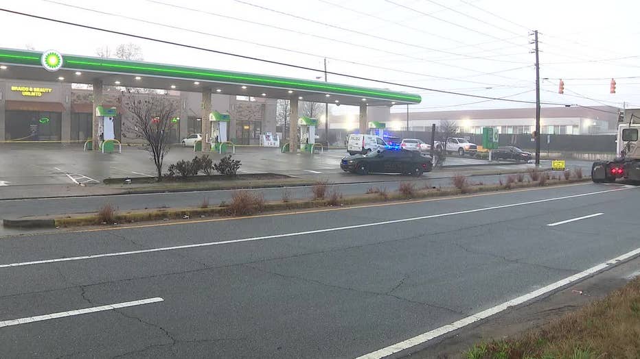 Police investigating near a gas station in the area of East Point and SW Atlanta.