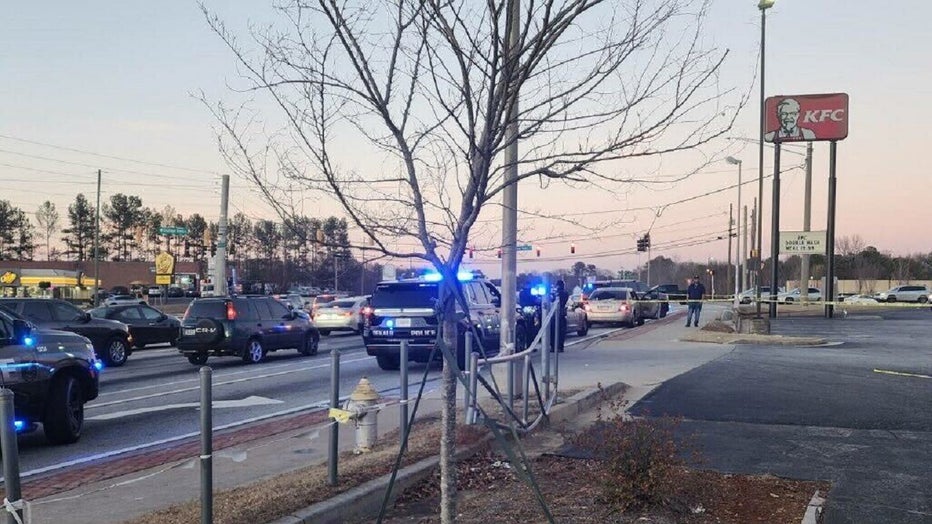 Police say they are investigating a shootout at a popular chicken fast-food restaurant in DeKalb County on Dec. 29, 2022.