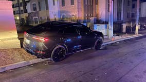 Man driving Lamborghini SUV nearly hits officer before crashing, police say