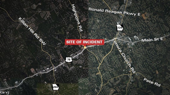 Snellville officer shoots armed suspect at gas station, police say