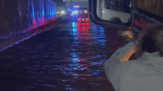 Woman trapped for hours after car stalls on flooded I-85