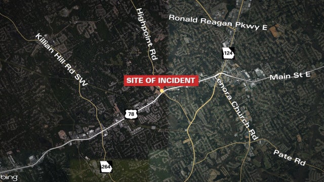 Snellville officer shoots armed suspect at gas station, police say