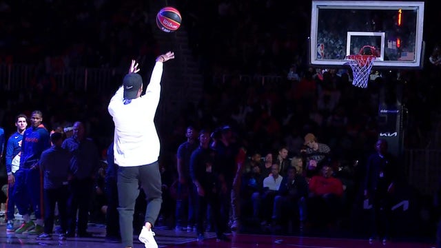 Hawks fan makes half-court shot at State Farm Arena for $10K