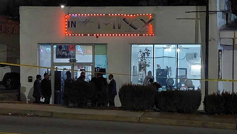 After the January 25, 2023 shooting, investigators surround In the Mixed Hair Studios on the corner of Moreland Avenue and Memorial Drive in southeastern Atlanta.