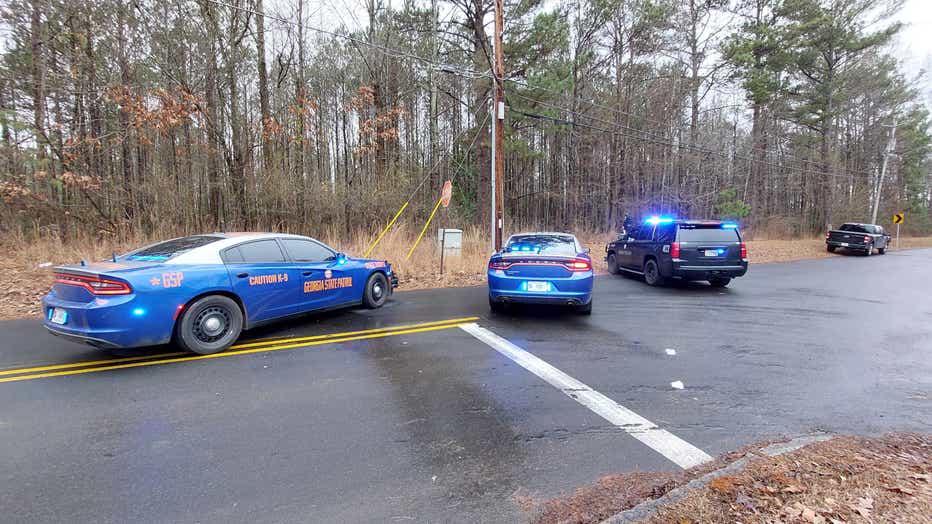 Georgia State Patrol investigate near the site of an alleged shooting.