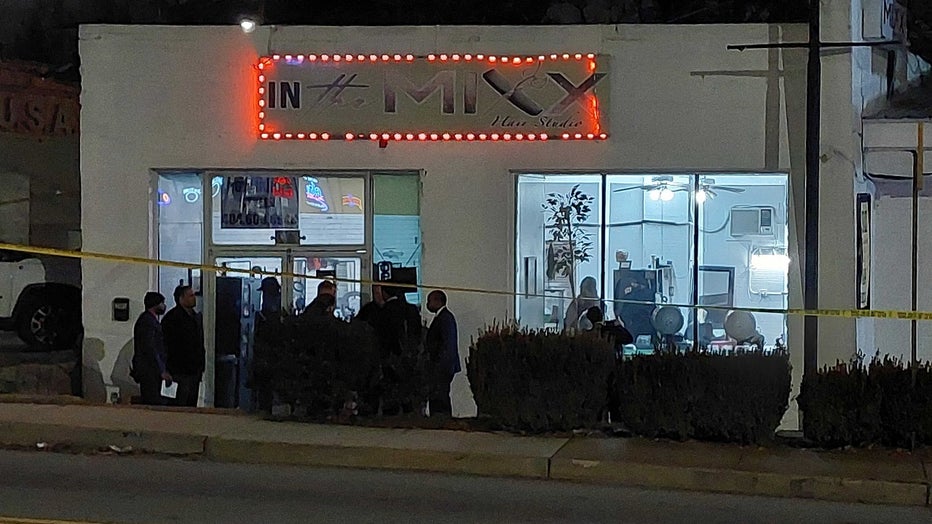 Investigators surround the In The Mixx Hair Studio located at the corner of Moreland Ave. and Memorial Drive in southeast Atlanta after a deadly shooting on Jan. 25, 2023.