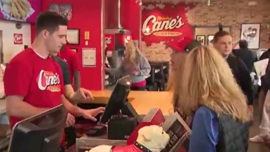 UGA's back-to-back championship-winning quarterback Stetson Bennett takes orders at the Raising Cane's Chicken Fingers in Athens on Jan. 12, 2023.