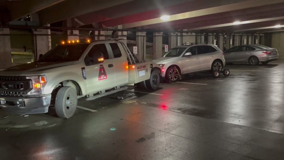 Atlanta police investigate after about two dozen vehicles were targeted for break-ins by three crooks in the garage of a Downtown Atlanta apartment building on the morning of Jan. 18, 2023.