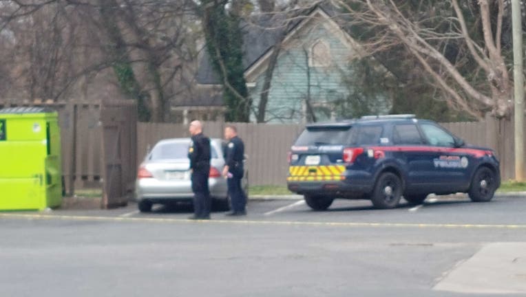 Police investigate a shooting at a southwest Atlanta gas station on Feb. 9, 2023.