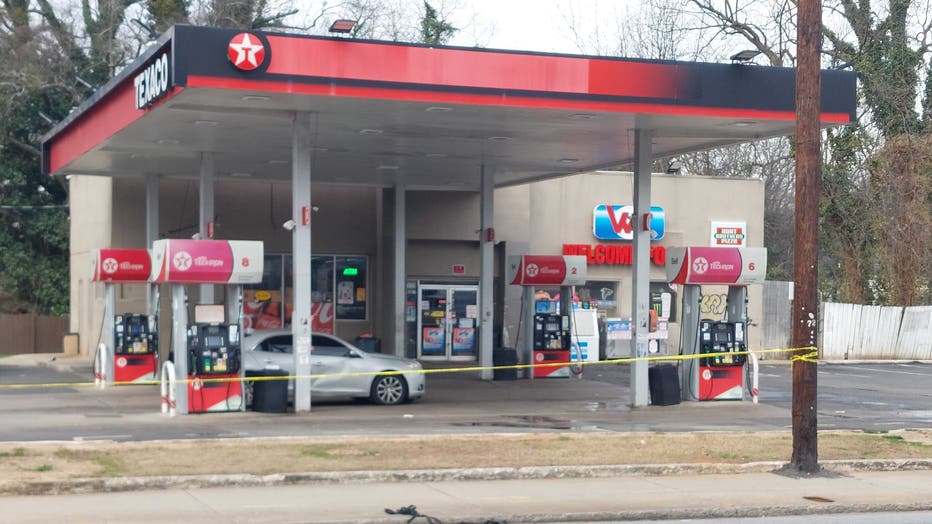 Police investigate a shooting at a southwest Atlanta gas station on Feb. 9, 2023.