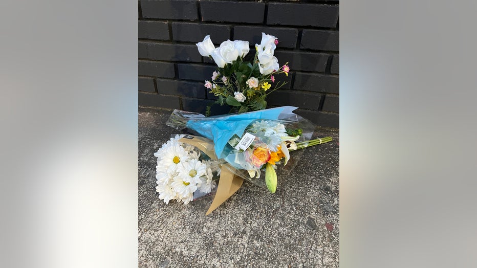 A small memorial grows at the spot where Republic Lounge owner Michael Gidewon was gunned down in front of his Atlanta establishment on Feb. 4, 2023.