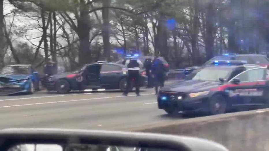 Atlanta police investigate the end of a brief chase that ended along I-20 just west of Downtown on Feb. 2, 2023.