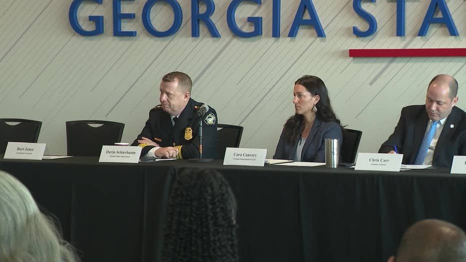 Law enforcement officials host Georgia Gov. Brian Kemp and Attorney General Chris Carr during a Georgia Anti-Gang Network meeting in Atlanta on Jan. 7, 2023.