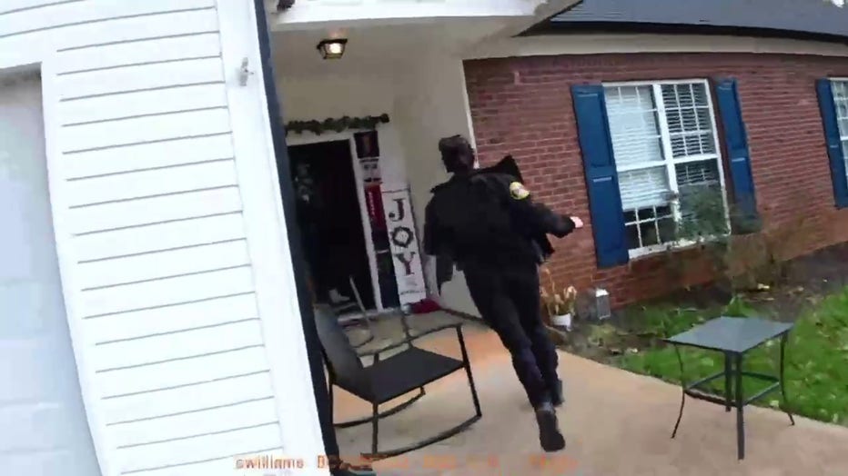 Officer Alexis Callaway runs into a home after a report of an infant that was choking.