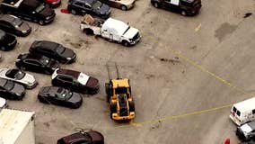 Woman killed by forklift carrying car at business in Lake City