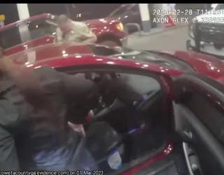 Body cam video provided by the Coweta County Sheriff's Office shows what investigators say is Jeffrey Pope and Allison Arrington after deputies find them passed out at a gas pump.