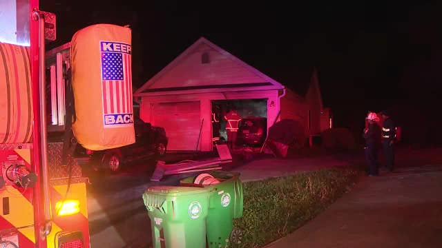 Woman found dead in garage of burning DeKalb County home