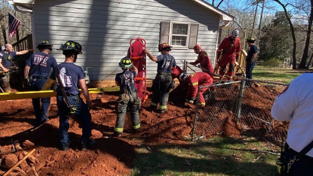 Photos show rescue of Woodstock man 'buried up to his neck' in collapsed trench