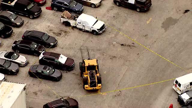 Woman killed by forklift carrying car at business in Lake City