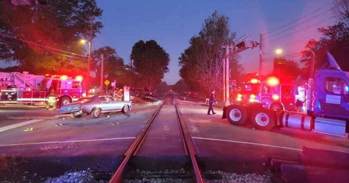 Tractor-trailer carrying cars for NBC Universal struck by train in ...