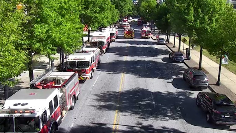 Fire engines line Peachtree Street after a report of a high-rise apartment fire on April 10, 2023.