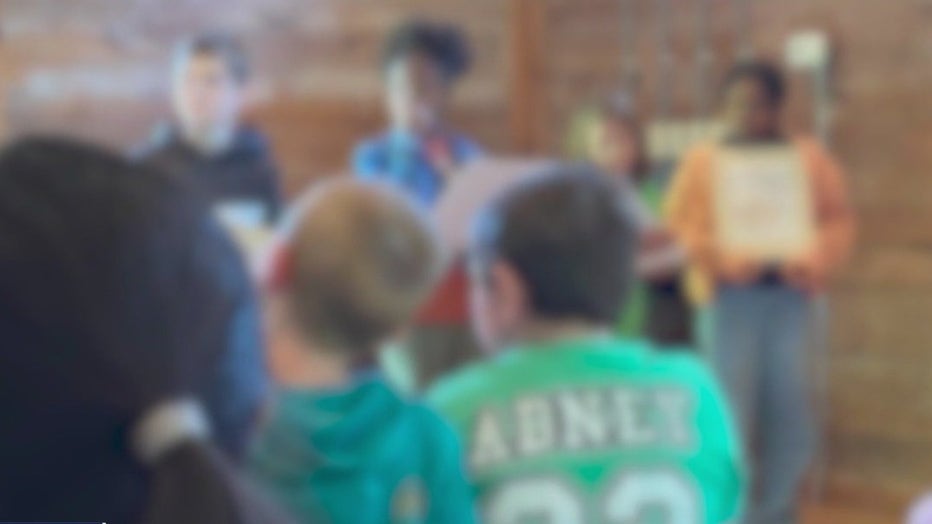 Still from video that shows students participating in a lesson on "slave auctioning" during a recent field trip to Mable House (FOX 5 Atlanta).