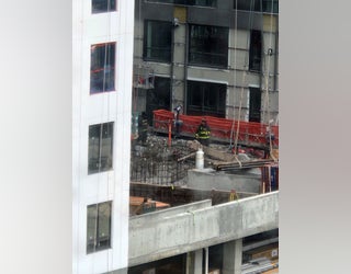A crane collapsed damaging a building under construction and injuring four workers in Midtown Atlanta on May 22, 2023.
