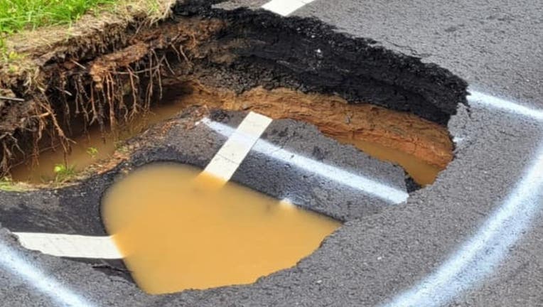 Giant sinkhole shuts down road in Cherokee County | FOX 5 Atlanta