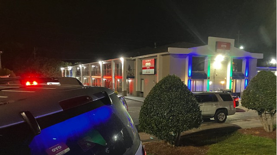 Investigators surround a Covington motel after a man was shot and killed by police during a disturbance call on May 23, 2023.