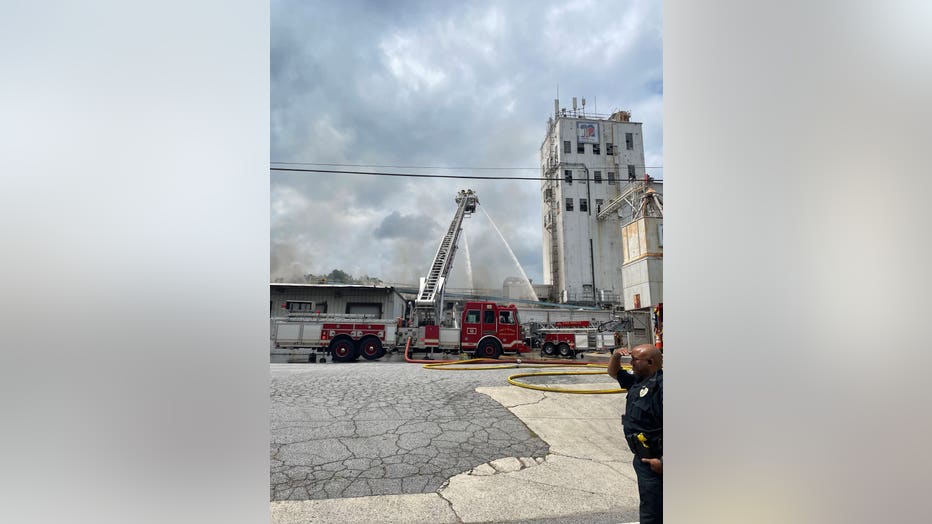 Firefighters are battling a fire at a former industrial site near downtown Chamblee on May 31, 2023.