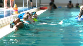 To take trip of her life, young Georgia cancer survivor must first learn to swim