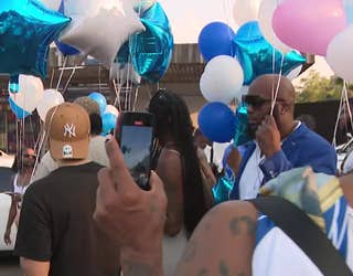 Loved ones release balloons to honor an off-duty security guard who was killed last weekend.