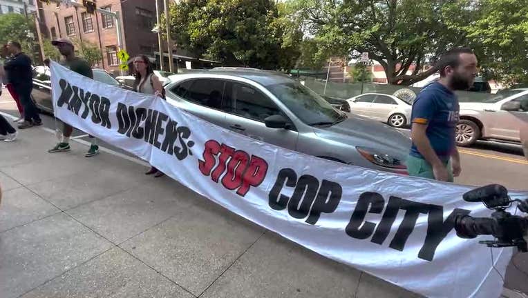 A protester was arrested after throwing meat at police officers during a demonstration over the Atlanta Public Safety Training Center on June 28, 2023.