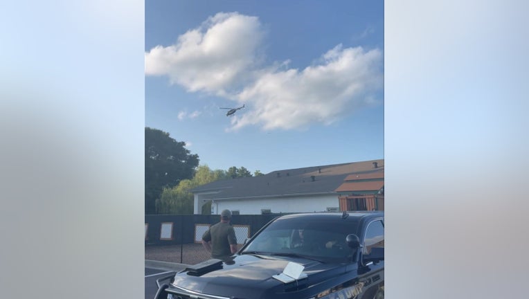 A helicopter flies over a section of Henry County searching for stray cattle on June 13, 2023.